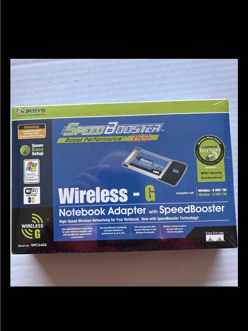 Linksys Wireless-G Notebook Adapter with Speed Booster blue/green packaging